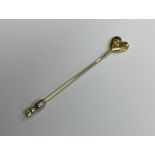 An 18 carat gold diamond heart shaped stick pin. R