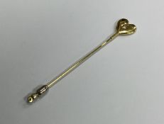 An 18 carat gold diamond heart shaped stick pin. R