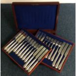 A mahogany cased set of 36 dessert knives and fork