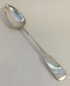A large heavy silver basting spoon. Dublin. By M W