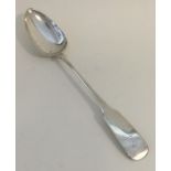 A large heavy silver basting spoon. Dublin. By M W