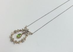 A Victorian peridot pendant surrounded by rose cut