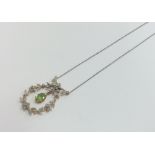 A Victorian peridot pendant surrounded by rose cut