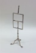 A tall Edwardian silver menu holder on ball and cl