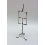 A tall Edwardian silver menu holder on ball and cl