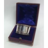 A plain heavy cased silver napkin ring with reeded