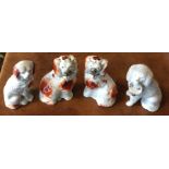 A pair of miniature Staffordshire dogs in seated p