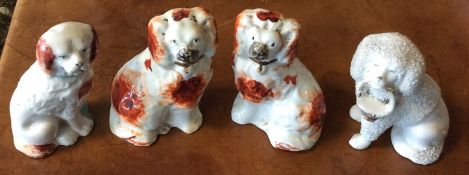 A pair of miniature Staffordshire dogs in seated p