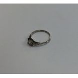 An Art Deco diamond single stone ring in square ru