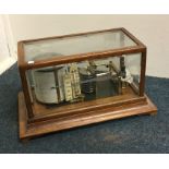 A good oak cased barograph on bracket feet. By Len