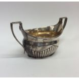 A Victorian silver half fluted sugar bowl with gil