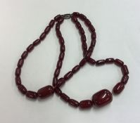 A double string of amber type beads. Approx. 80 gr