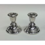 A pair of small silver dwarf candlesticks. Birming