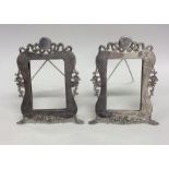 A pair of Chinese silver picture frames decorated