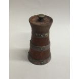 An oak mounted pepper mill of tapering form with s