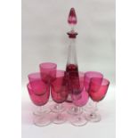 A set of eight cranberry glasses together with a d