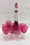 A set of eight cranberry glasses together with a d