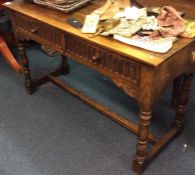 An oak two drawer table.