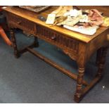 An oak two drawer table.