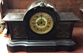 An old slate mantle clock.