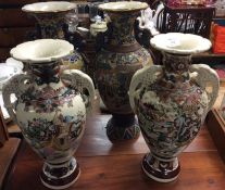 Two pairs of large decorative vases.