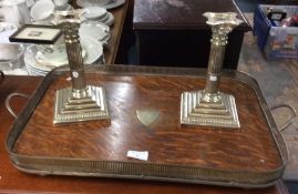 An oak gallery tray, together with a pair of candl