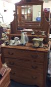 An Edwardian satinwood dressing chest.