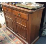 A mahogany two drawer sideboard.