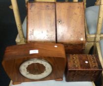 A mantle clock together with two writing boxes.