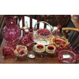 A collection of cranberry glass.