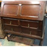 An oak barley twist bureau.