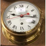 A brass mounted ships clock engraved Topsham.