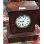 A small oak mantle clock.