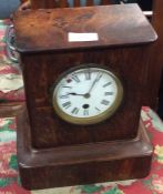 A small oak mantle clock.