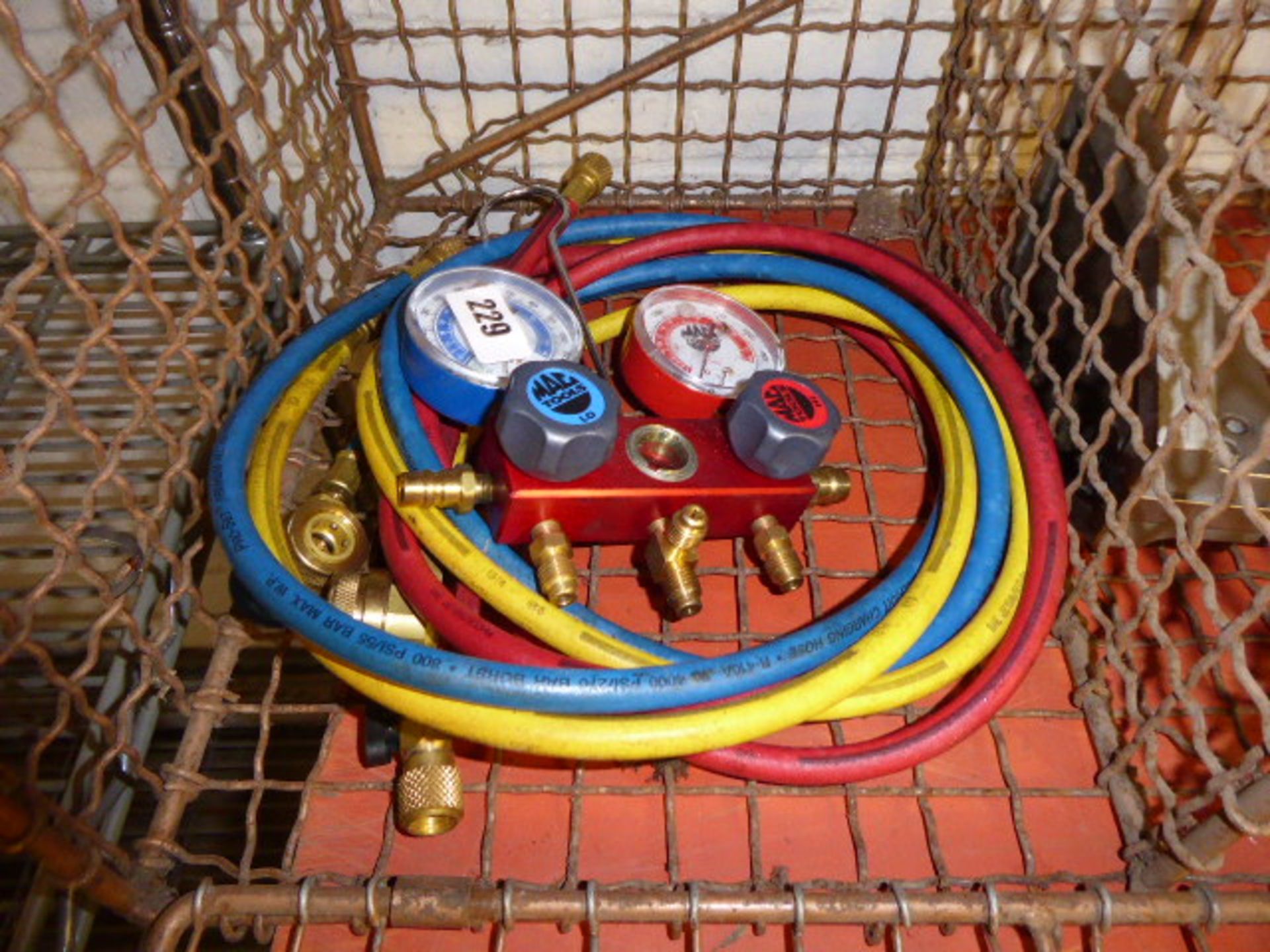 Pair of Mac tools, gauges and hose