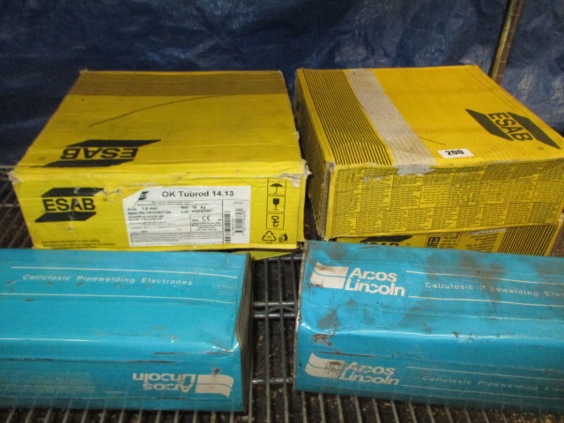 4 boxes Esab welding wire and 2 boxes cellulosic rods