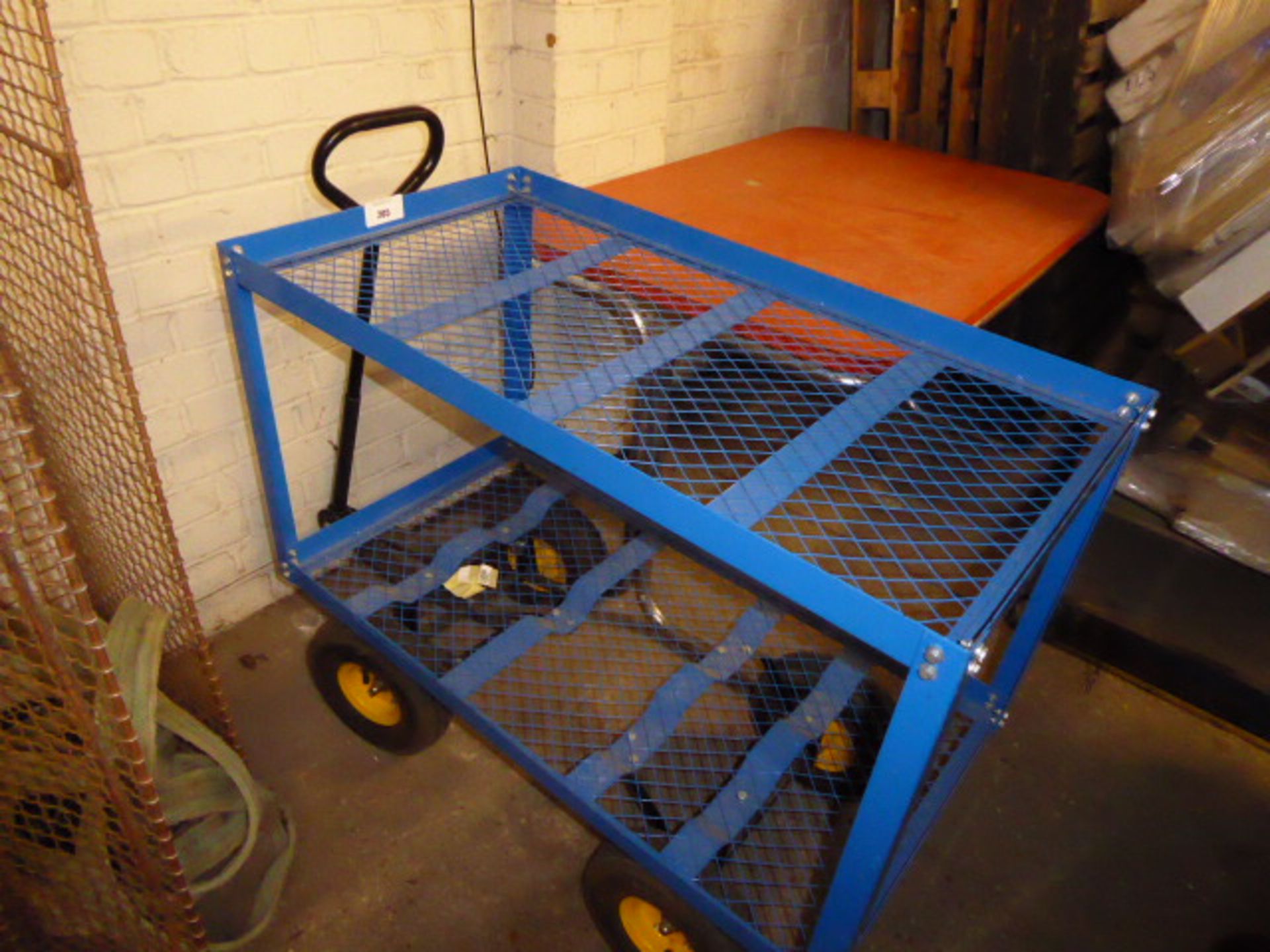 Blue metal 4 wheel barrow with handle