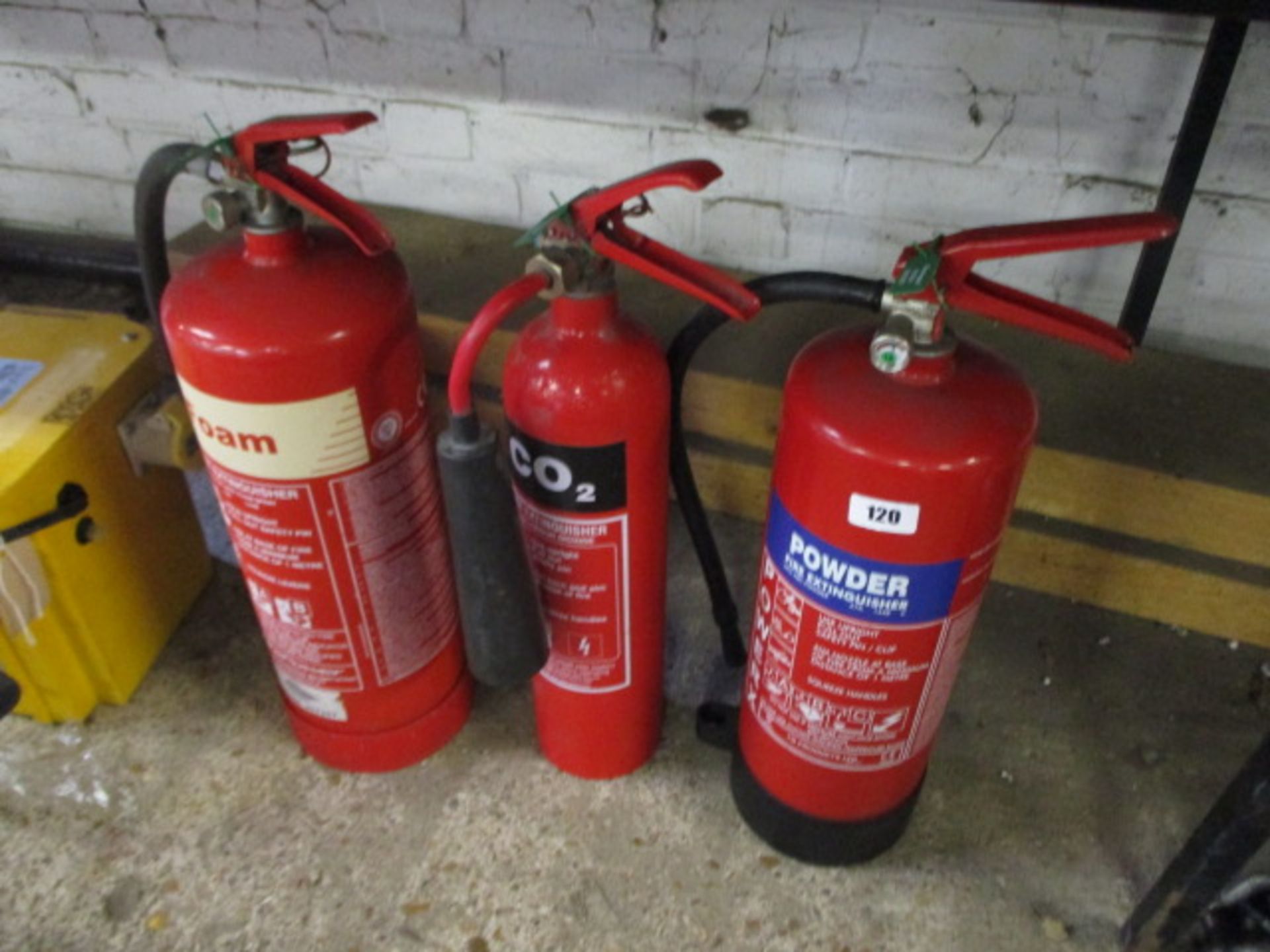 3 assorted fire extinguishers