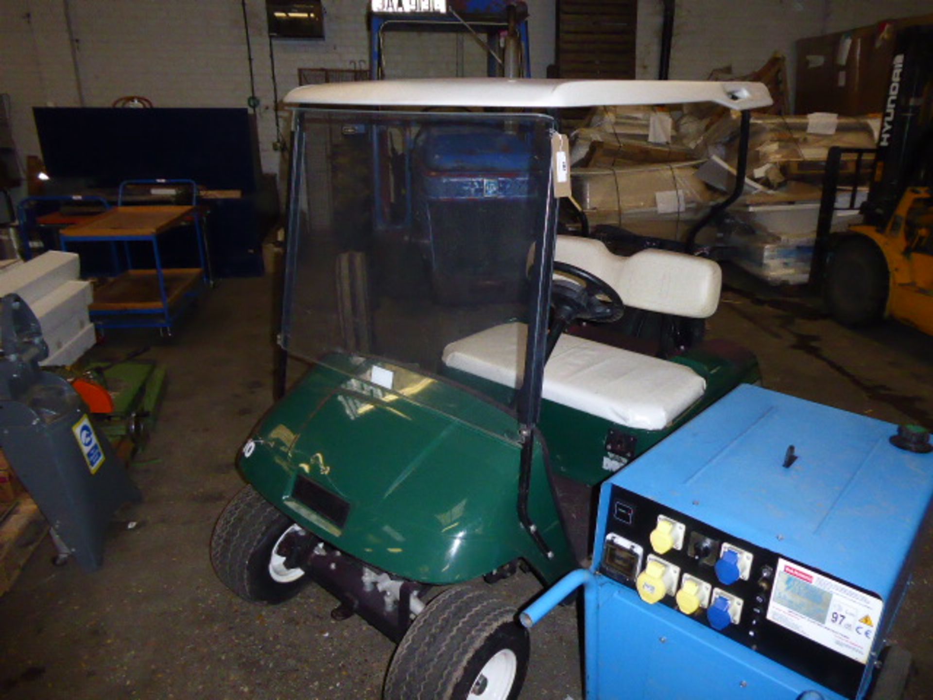 TXT48 E-Z-GO 48v golf trolley with built in charger on rear knobbly tyres plus pair of spare tyres