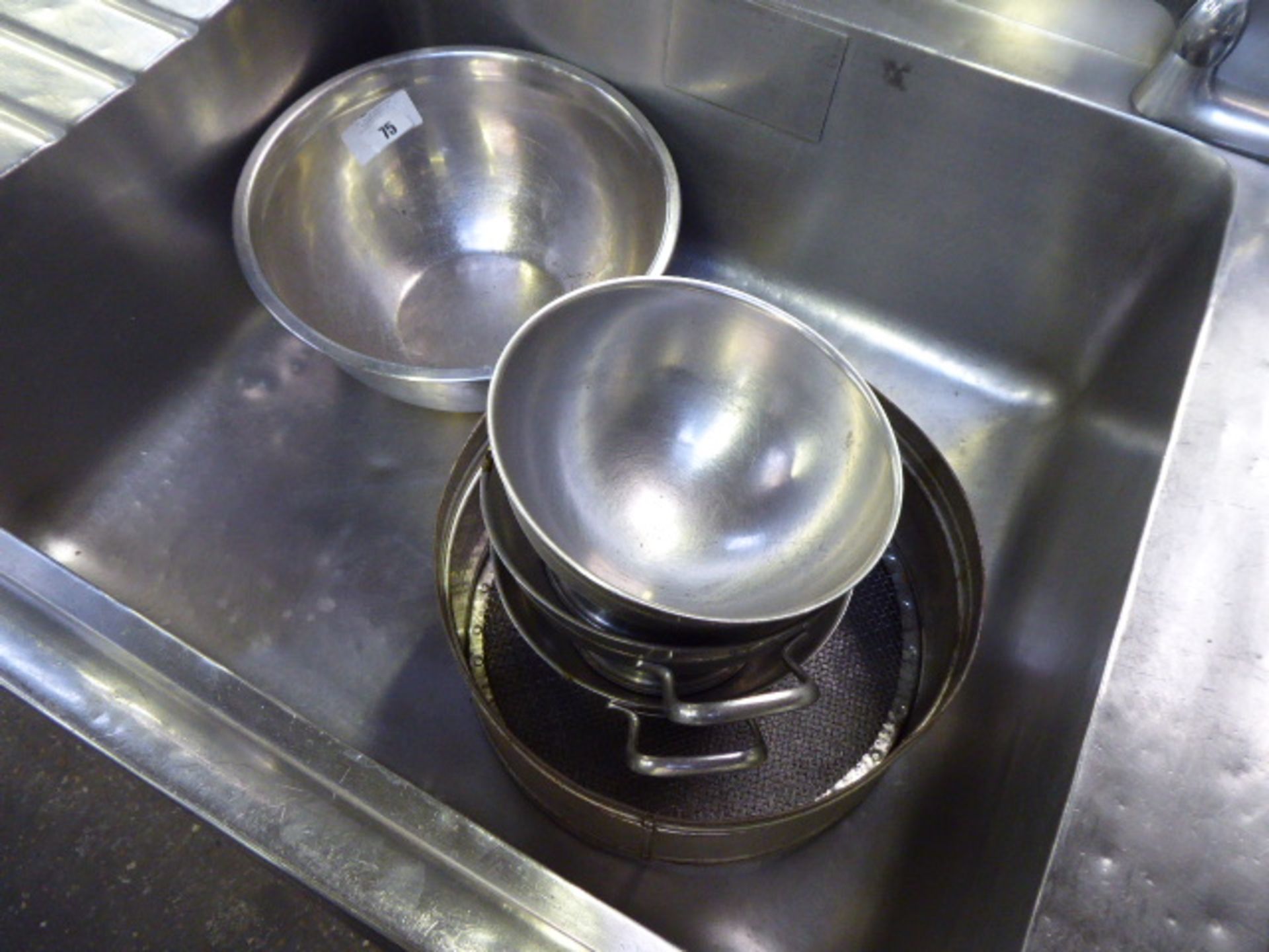 Contents of 2 sinks incl. colander, mixing bowls, balti type dishes, sieve, etc.