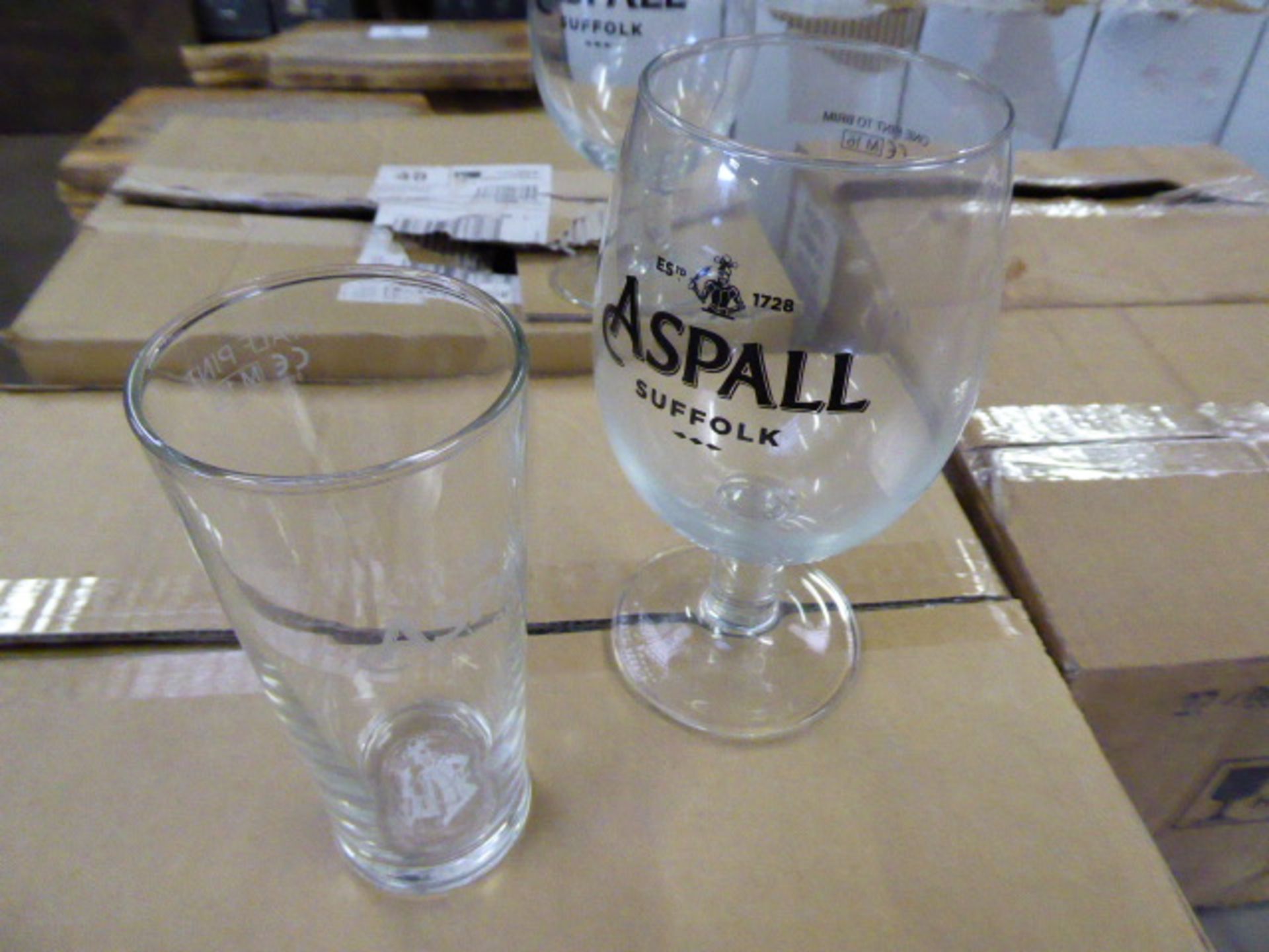 5 boxes containing branded drinking glasses, mainly Aspall