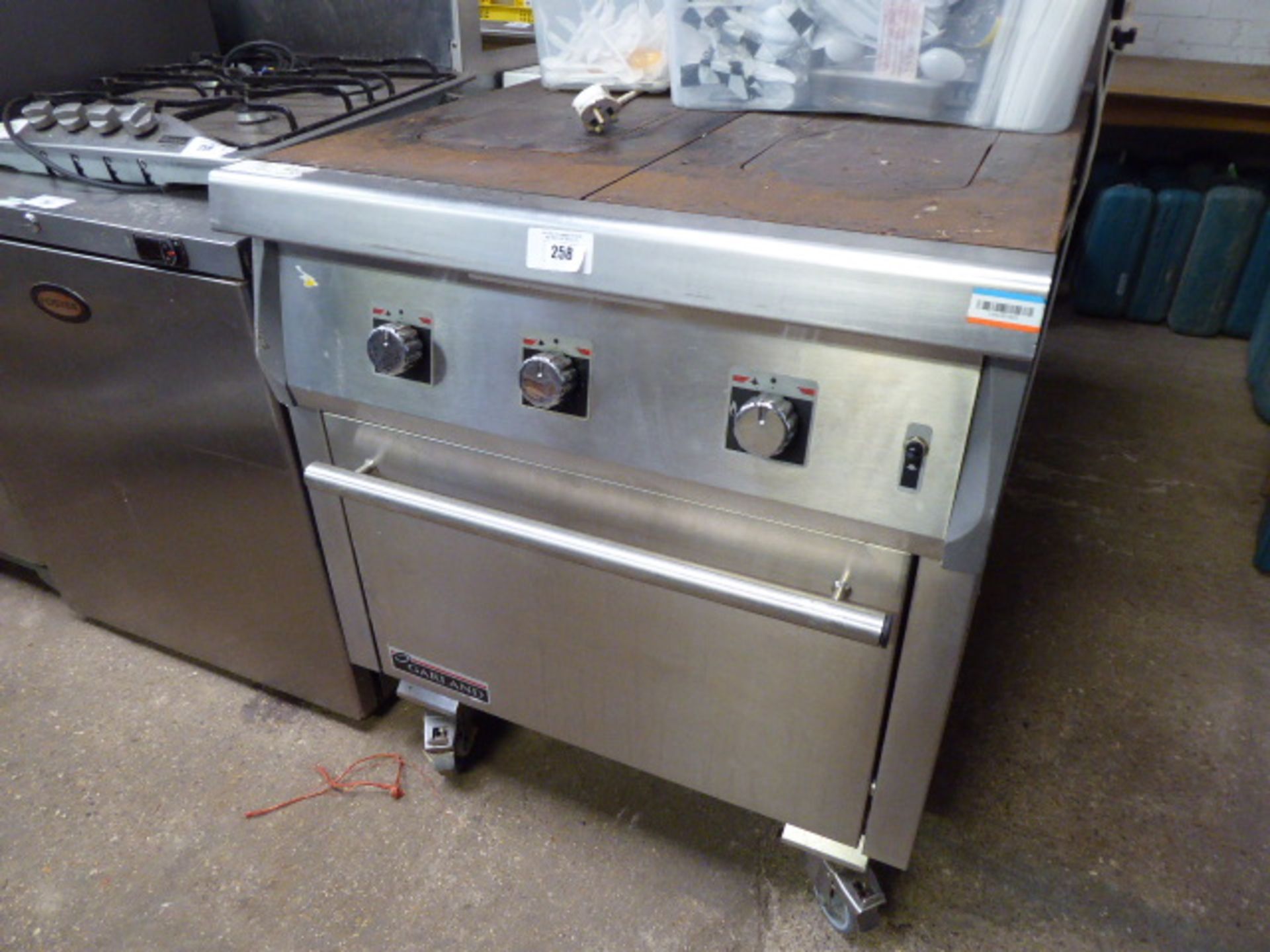 (76) 80cm gas Garland solid top cooker with 2 burners and large single door oven under on castors,