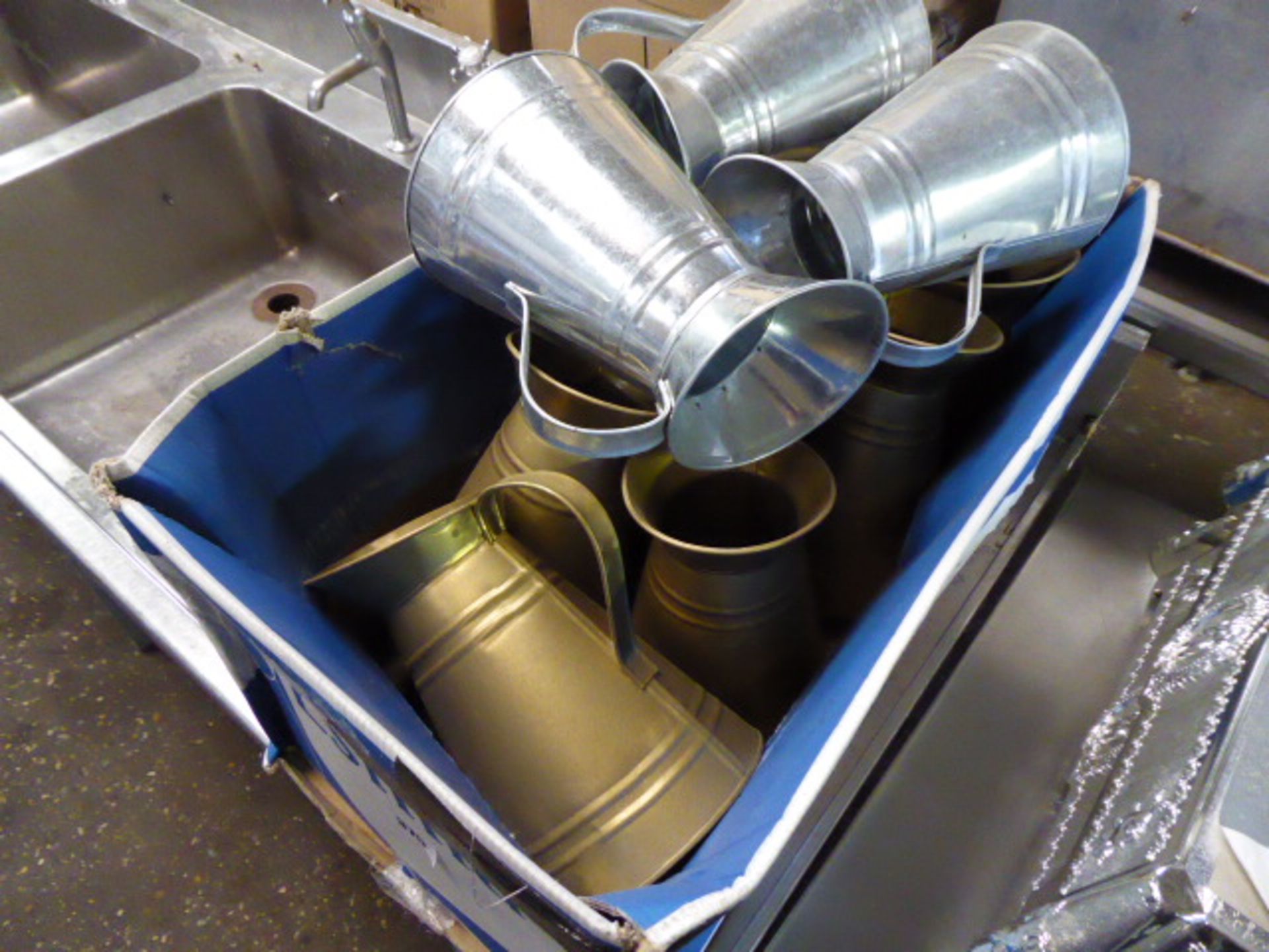 Tray of water jugs in galvanized and brass finish