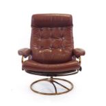 A 1970's Ekorness 'Stressless' brown button upholstered armchair on a copper coloured swivel base