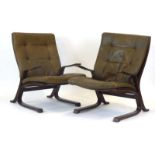 A pair of bentwood lounge armchairs with green button upholstery,