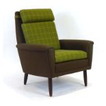 A 1960's Danish highback armchair with two tone green upholstery,