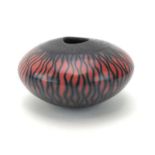 A studio pottery squat vase, the red and black glaze in the form of flames, inscribed AGH to base,