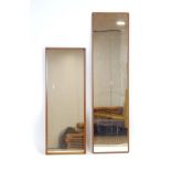 A 1970's Danish teak framed wall mirror of rectangular form, 150 x 40 cm and another, smaller,