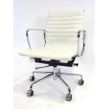 After Charles and Ray Eames, a 'Softpad'-type executive desk chair with white upholstery,