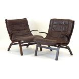 A pair of 1970's Farstrup bentwood lounge armchairs with brown upholstery CONDITION